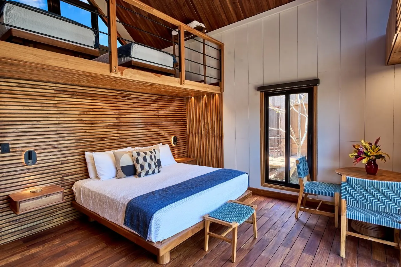 TreeCasa cabin — warm wood interior with natural light and forest views