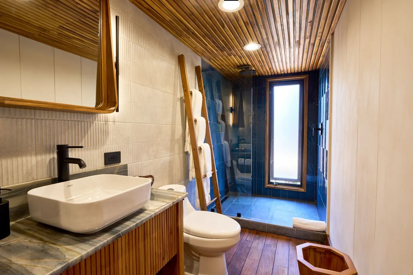 TreeCasa cabin — warm wood interior with natural light and forest views