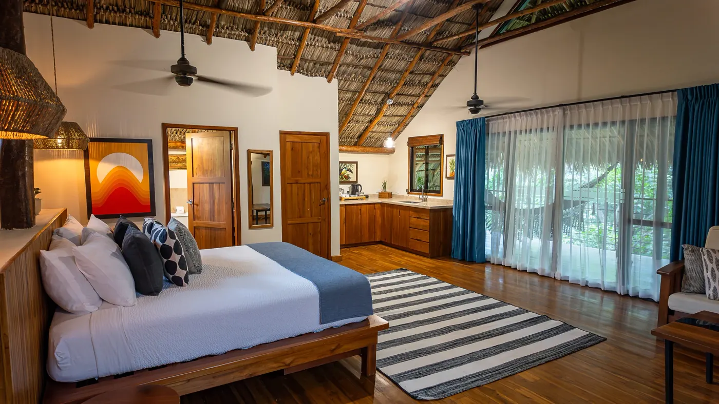 Canopy suite at TreeCasa — private balcony and hammocks overlooking the forest