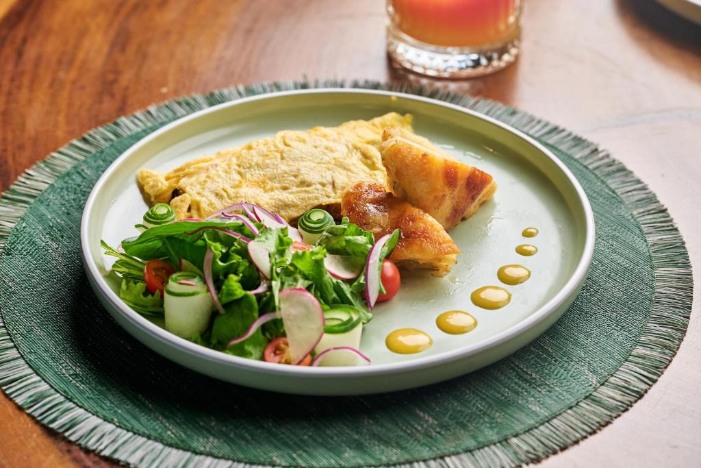 A shared meal at TreeCasa, plates and natural light on a wooden table