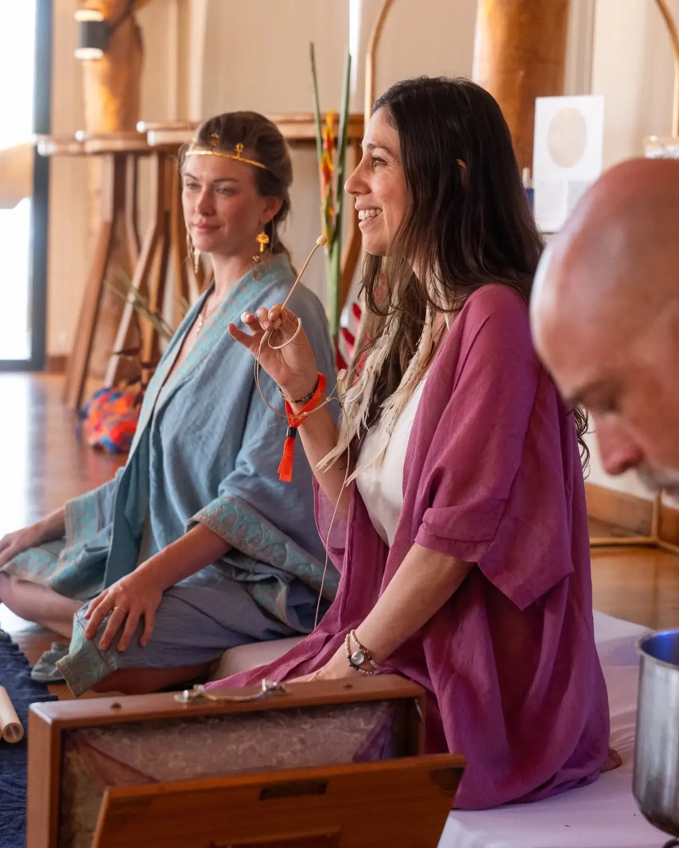 Two performers in flowing robes leading a sound and ceremony moment at TreeCasa
